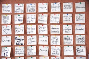 A corkboard with motivational sticky notes, ideal for planning and creativity.