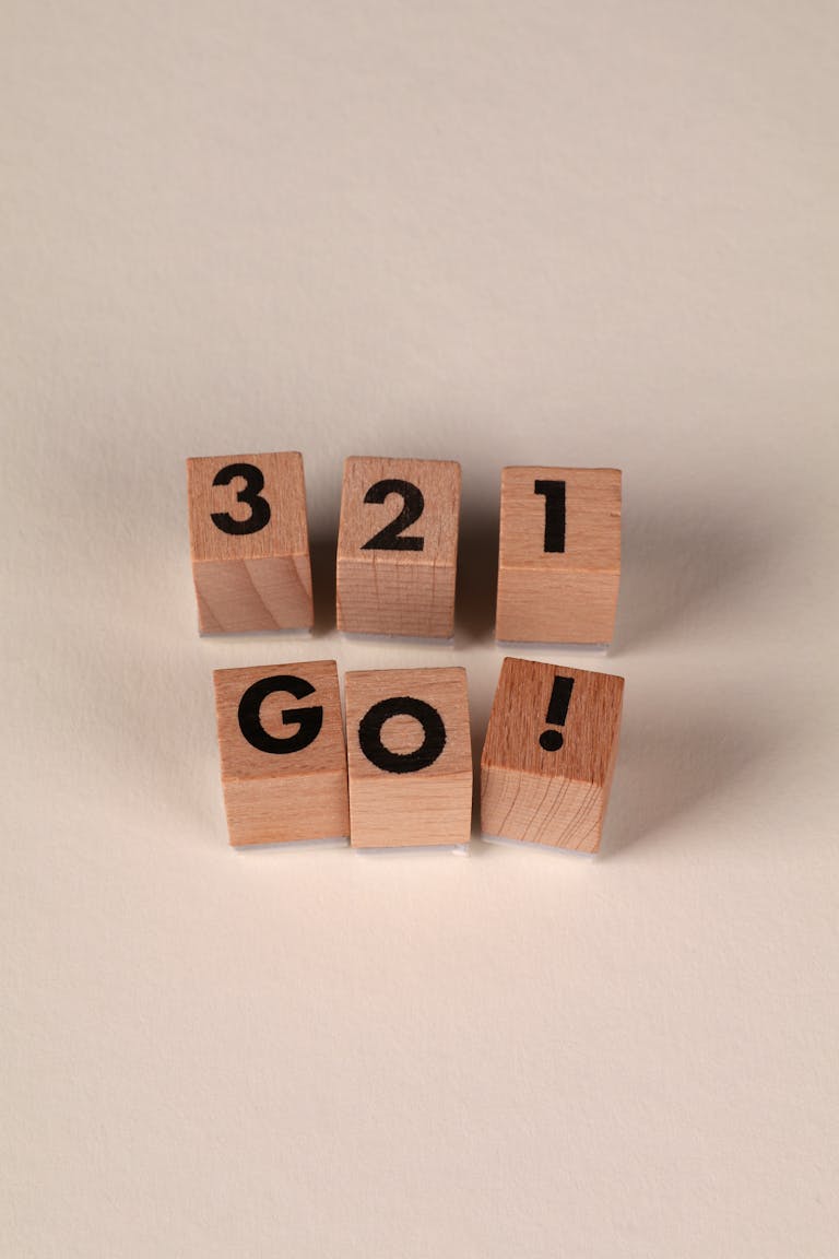 Wooden blocks displaying '3 2 1 GO!' for motivational or competitive themes.